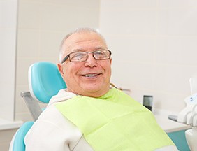 patient smiling about getting dental implants