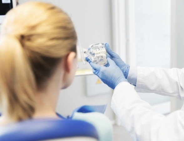 Dentist and patient talking during preventive dentistry checkups and teeth cleanings