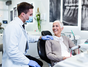 Patient smiling at dentist during routine visit