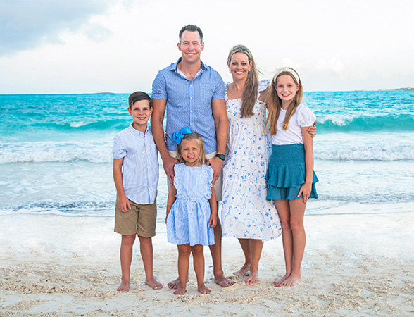 Doctor Dillard and his family smiling together