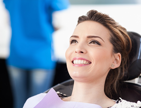 Woman smiling after Arestin antibiotic therapy