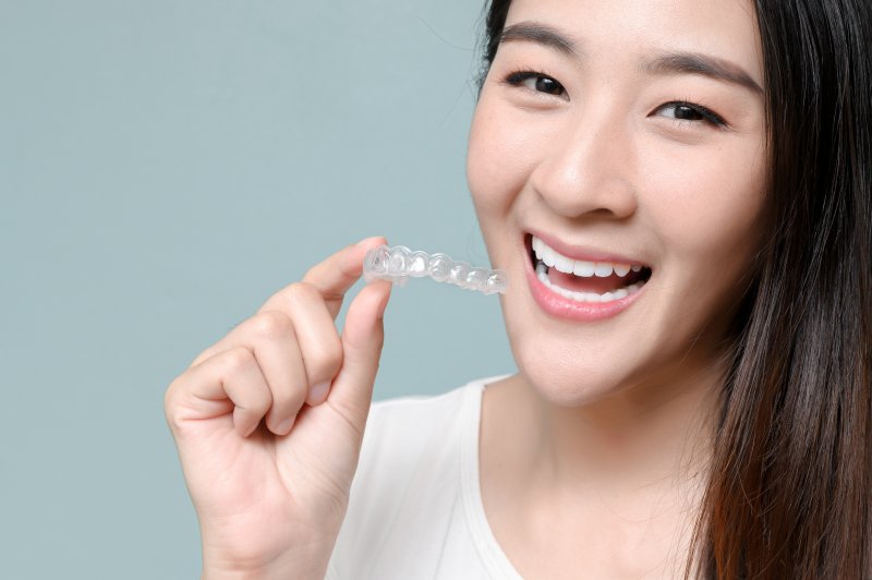 patient holding clear aligner